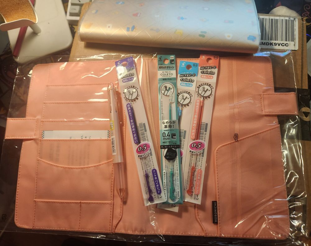 a hobonichi journal cover and new Pilot Hi Tec C Coleto with many colors of ink