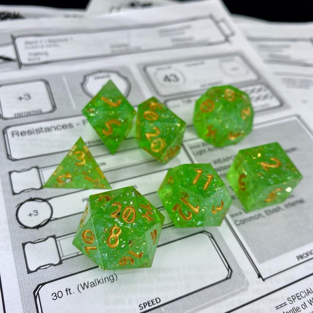 A green glittery dice set
