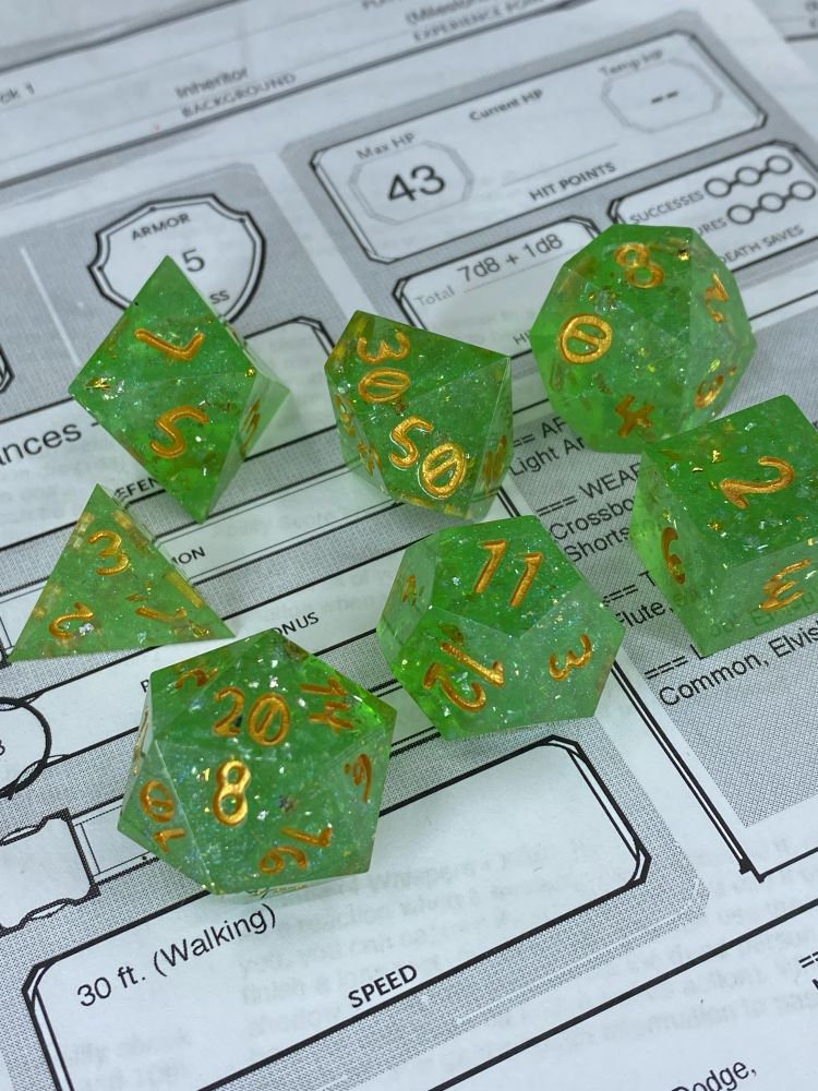 A green glittery dice set