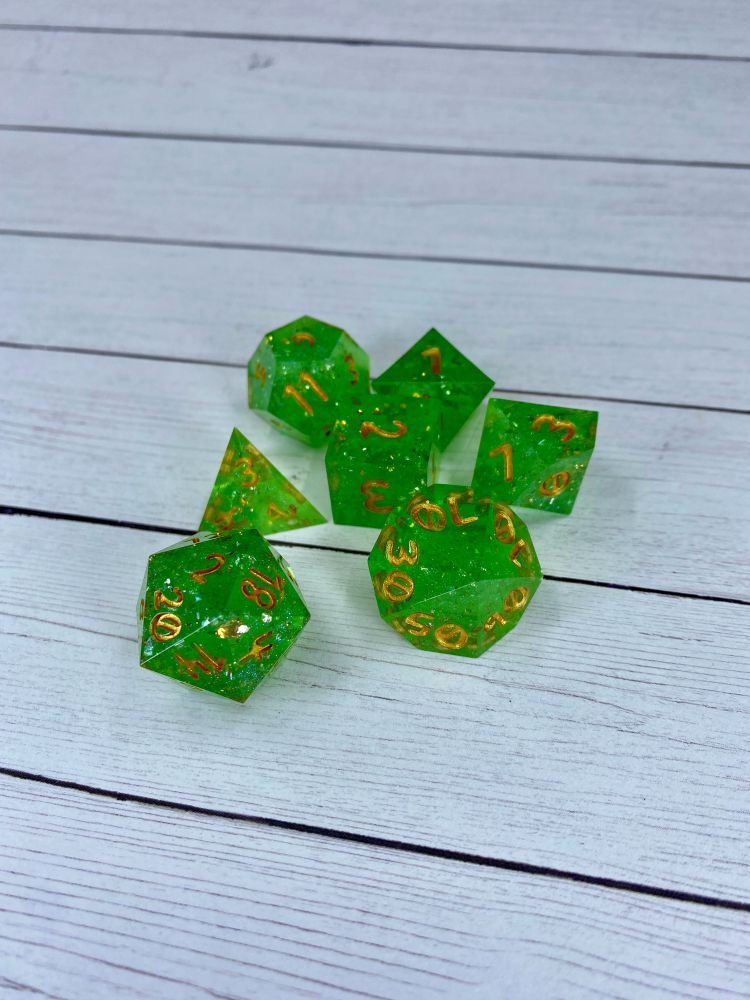 A green glittery dice set