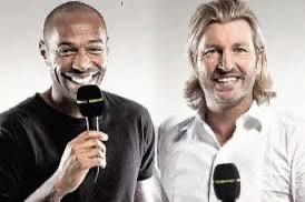 Thierry Henry and Robbie Savage, holding microphones