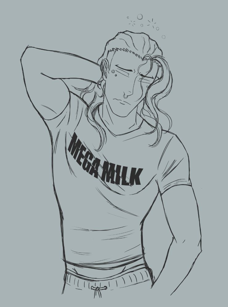 A tall, fit man wearing a shirt slightly too tight for him, the words "Mega Milk" stretched slightly over a built chest.