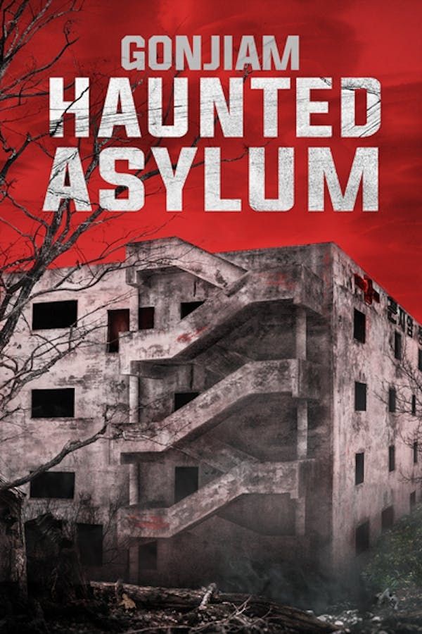 A creepy, decrepit building exterior under a red sky.