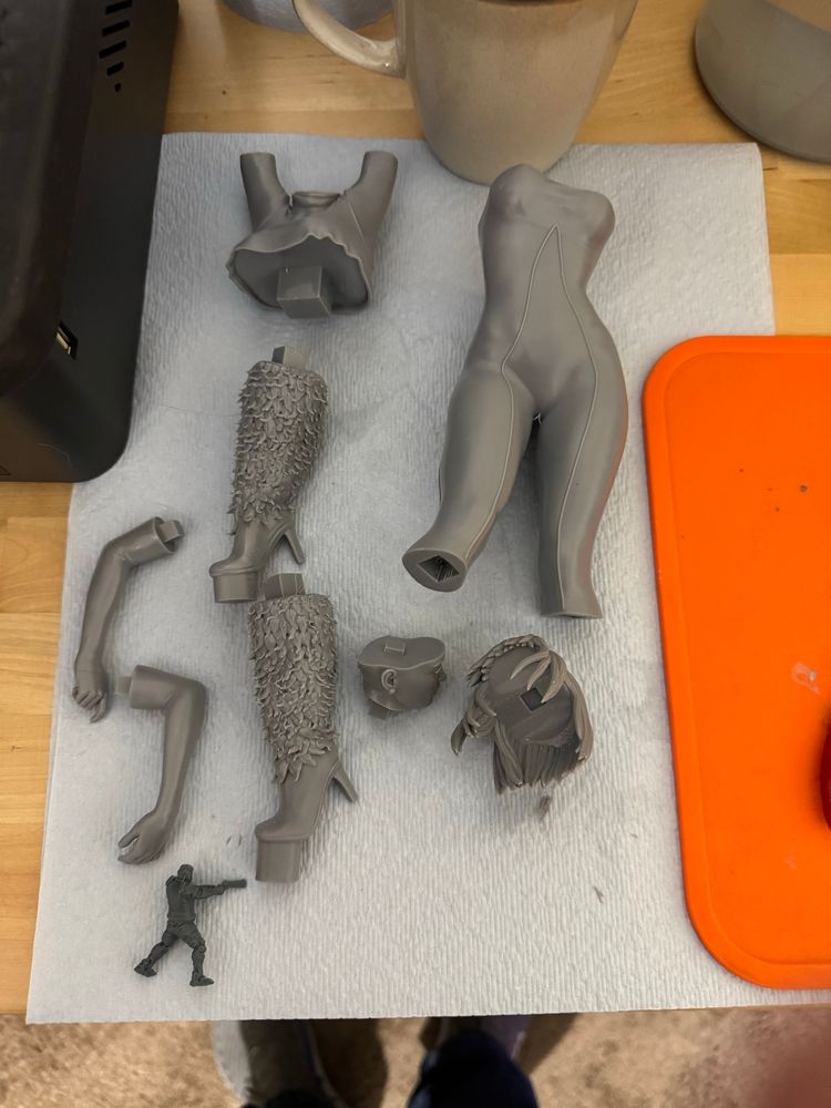 3-D printed pieces of a statue featuring the superhero, heroine Ice, from the Justice league