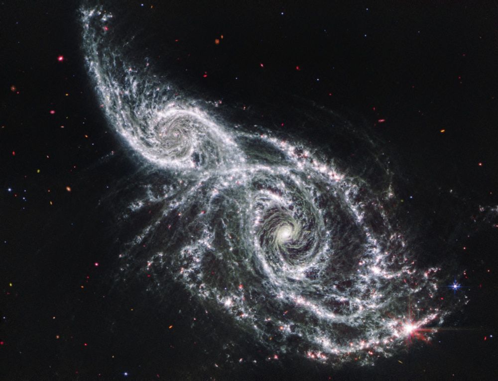 infrared image of merging galaxies IC 2163 and NGC 2207 by the MIRI instrument on the James Webb Space Telescope