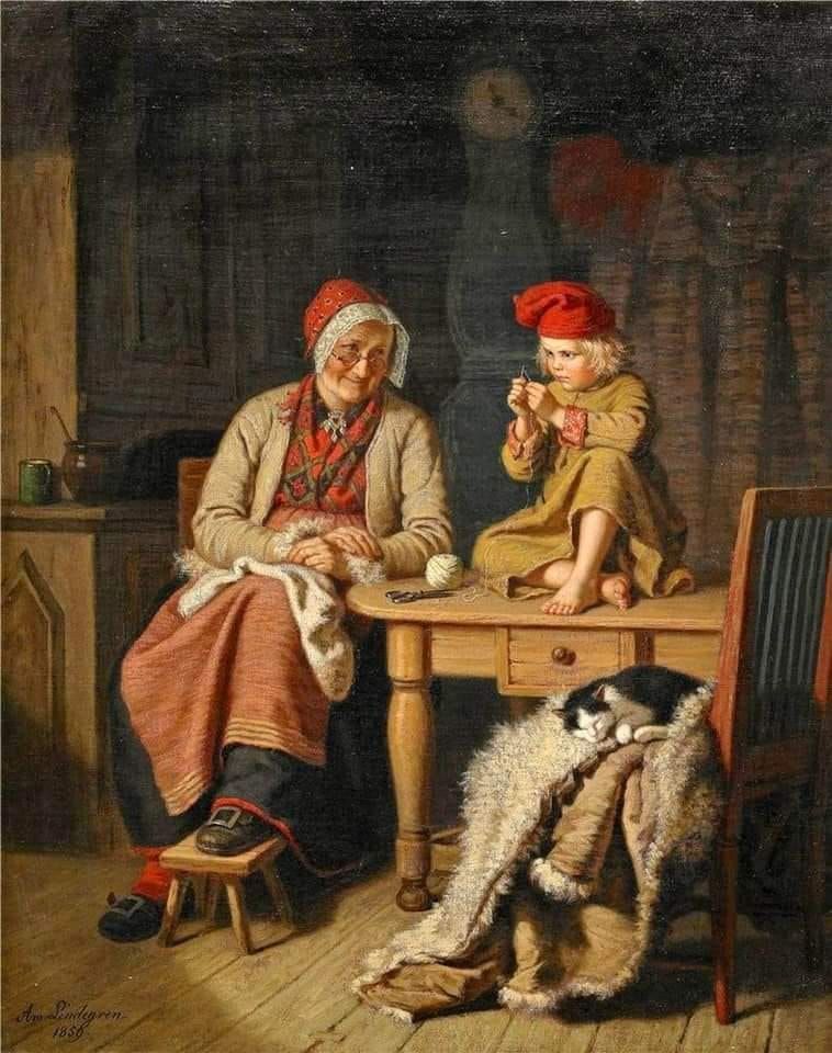 Eine Großmutter mit einem Enkel, der einem Schneider gleich auf dem Tisch eine Nadel einfädelt sowie einer auf einen gefütterten Ledermantel, der auf einem Stuhl liegt, schlafenden schwarzweißen Katze