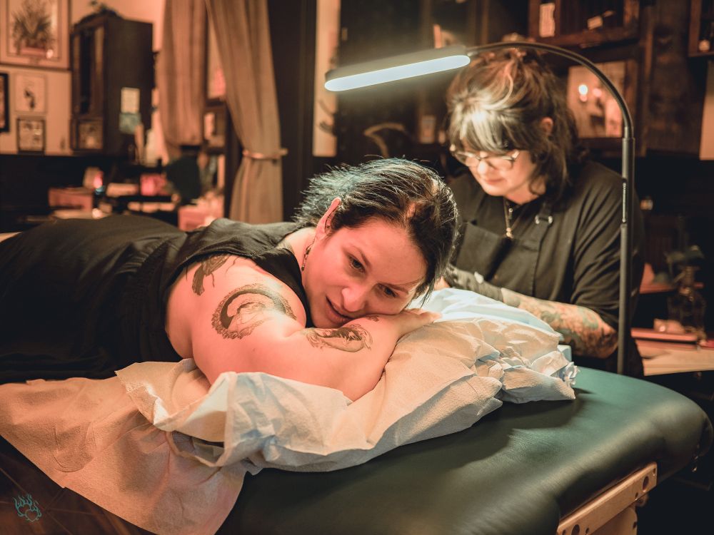 My friend C getting tattooed by our artist, Erica.