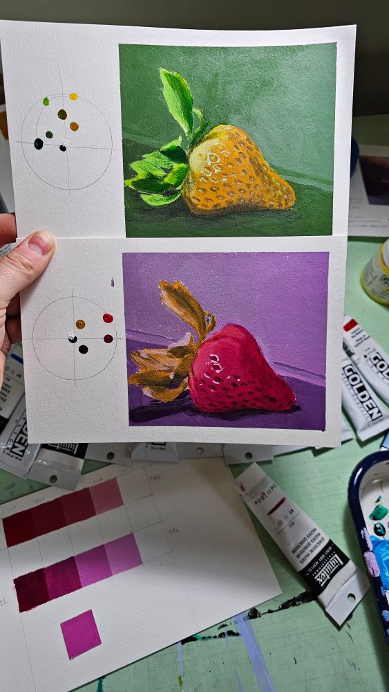 Two color studies of a strawberry. The top is in a limited palette leaning green, the bottom is in a limited palette leaning purple.