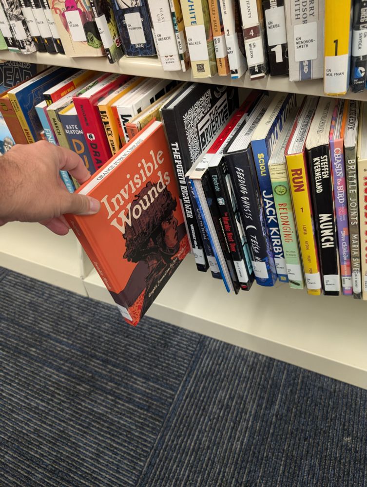 Invisible Wounds by Jess Rullifson, pulled out from a library bookshelf