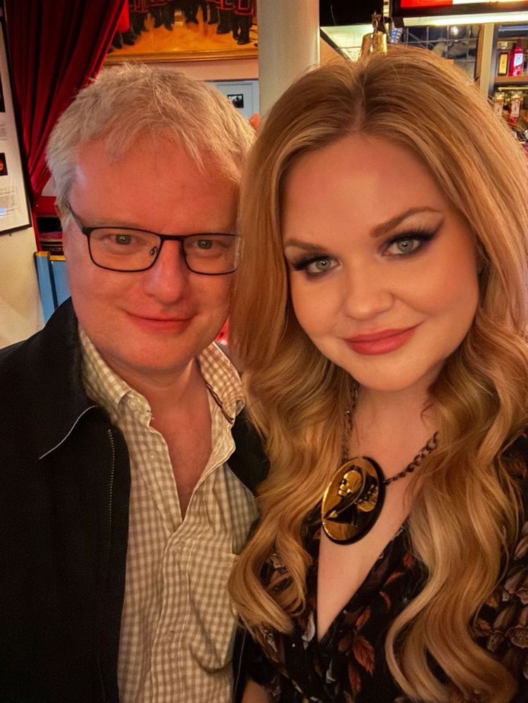 A photo of Adrian and Lindsey smiling 