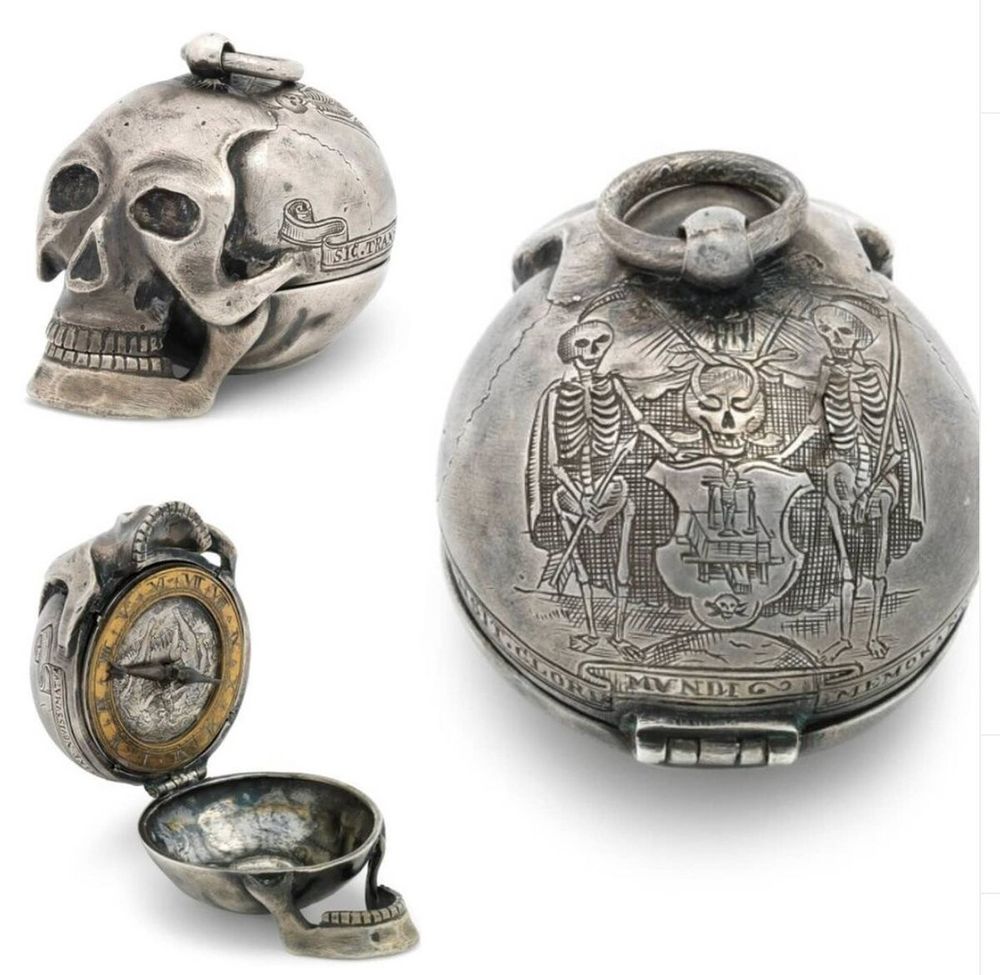A pocket watch shaped like a skull with engravings of skeletons. The skull opens to reveal a clock inside.