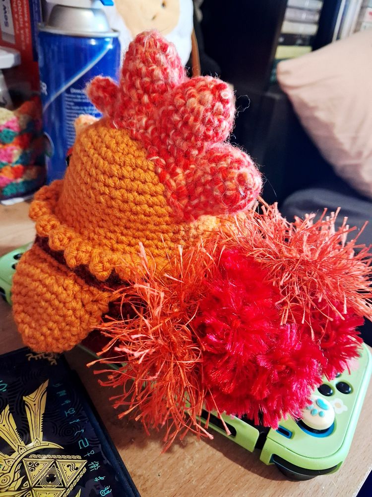 back view of rooster showing off his luxurious tail.