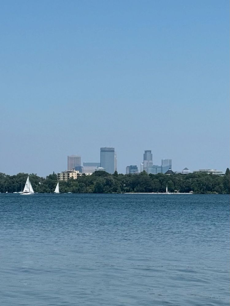 Looking north across Bde Maka Ska toward the skyscrapers of downtown Minneapolis.