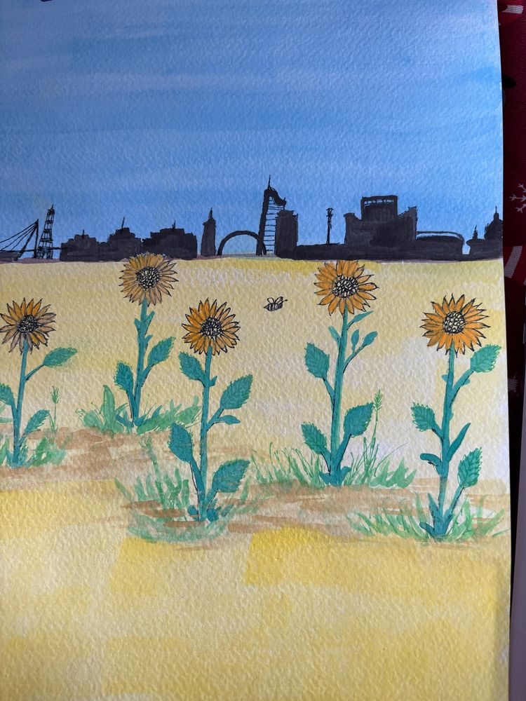 Water color painting blue above, gold below.  Several sunflowers and a small bee on the gold half, Kyiv skyline approximation on the blue half rendered in black. 
