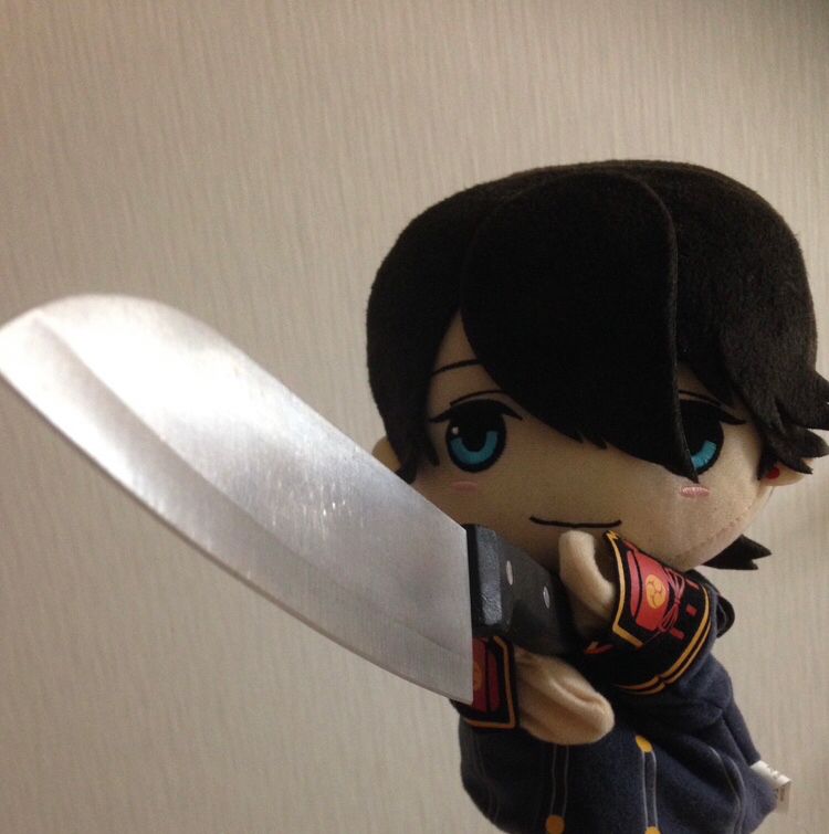 Horikawa Kunihiro hand puppet holding a large kitchen knife threateningly. 