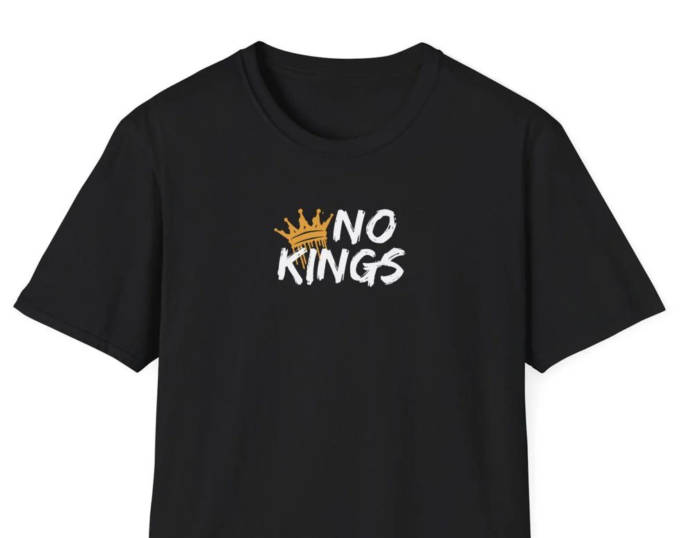 Black shirt with white text saying NO KINGS and a golden crown graphic