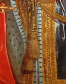 We are looking at a close up of an oil painting showing two large gold tassels which wouldn't look out of place holding back a pair of ornate curtains.