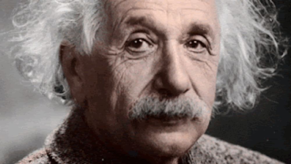 a close up of albert einstein 's face with gray hair and a mustache