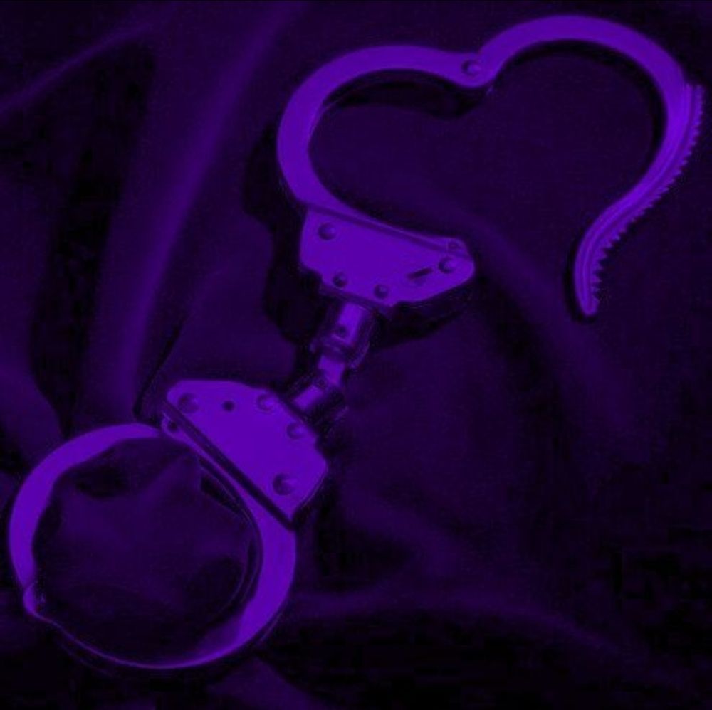 pic of purple handcuffs in the shape of a heart <3