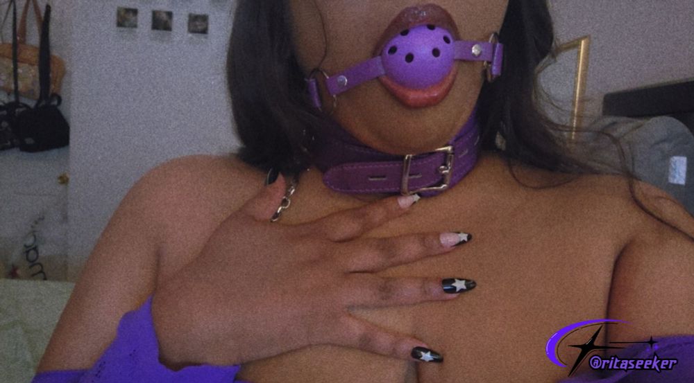 ser is wearing a purple gag and a purple collar with a leash <3