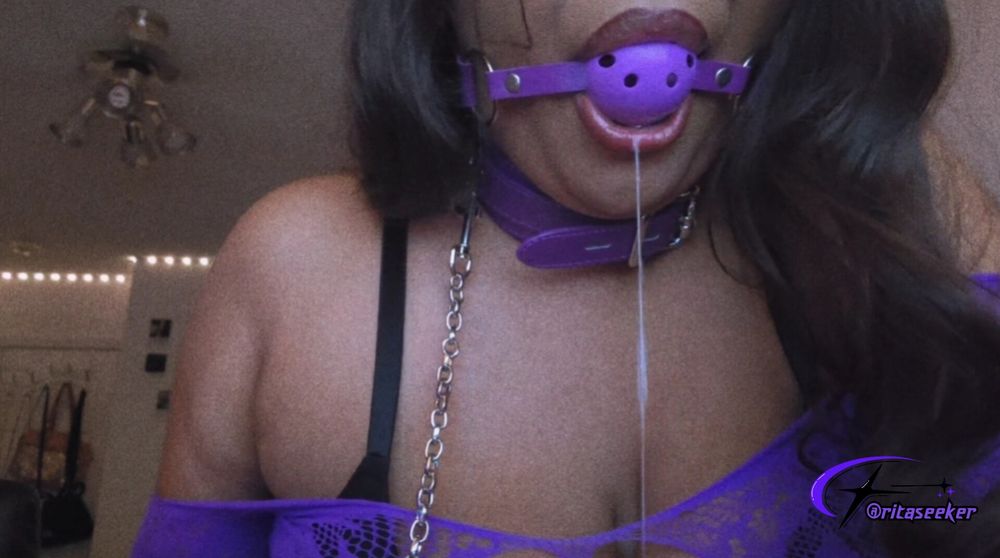 ser is gagged making a mess while wearing a purple collar, leash, black bra, and a purple fishnet dress <3