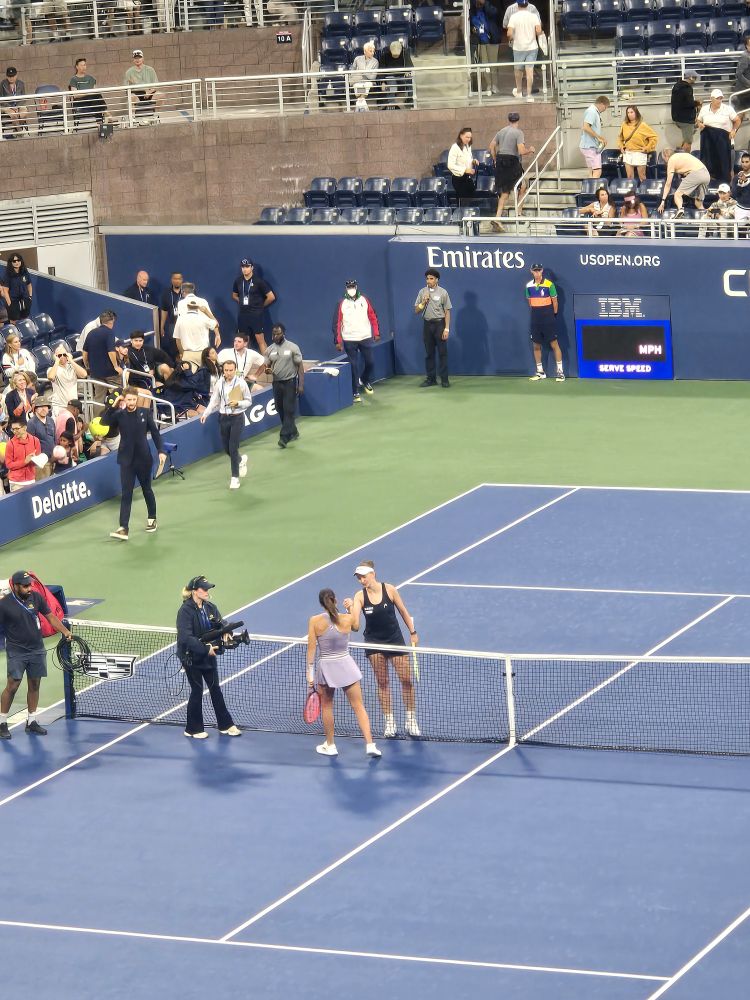 Krejcikova greets Navarro at the net post-match