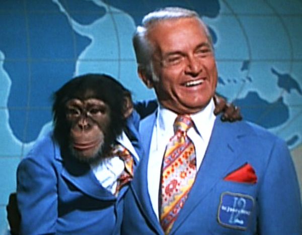 Newsman Ted Baxter (played by the brilliant Ted Knight) in the Mary Tyler Moore Show, posing with a chimp friend.