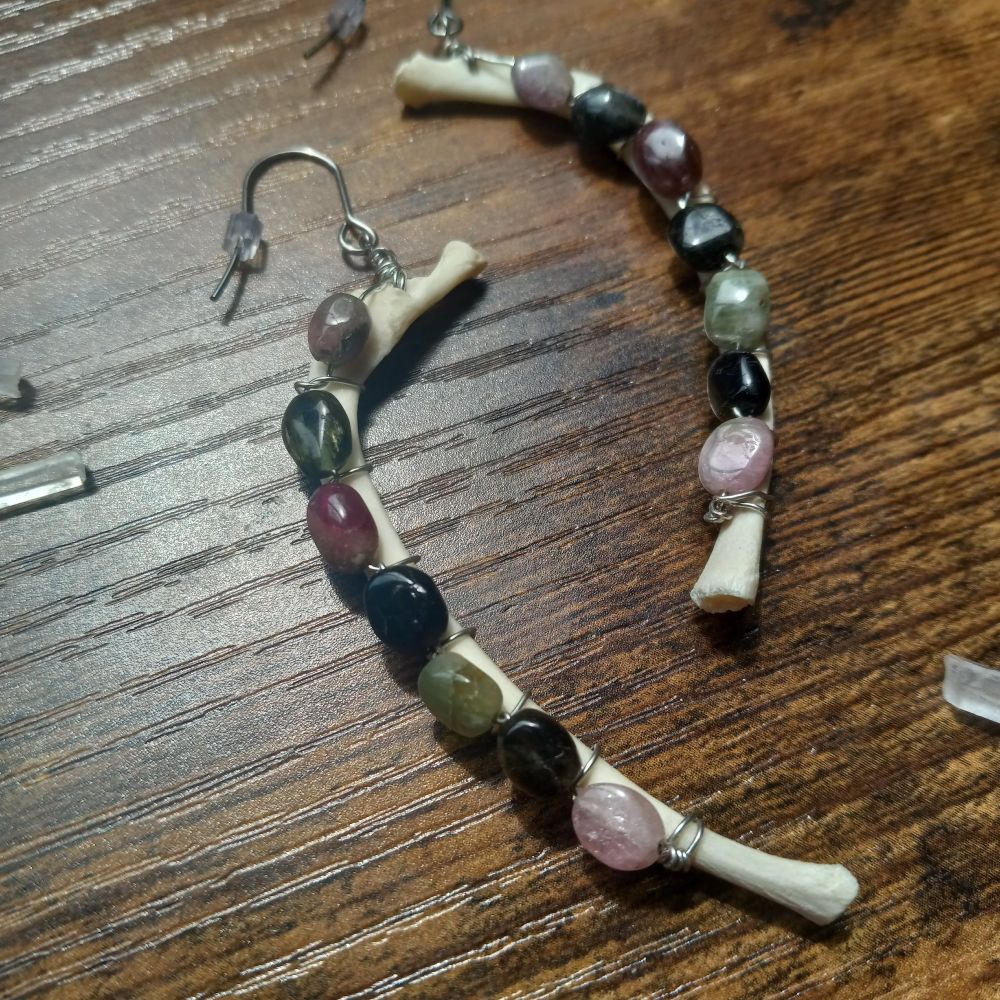 Ethically sourced rabbit rib bones wire wrapped with watermelon tourmaline beads. 