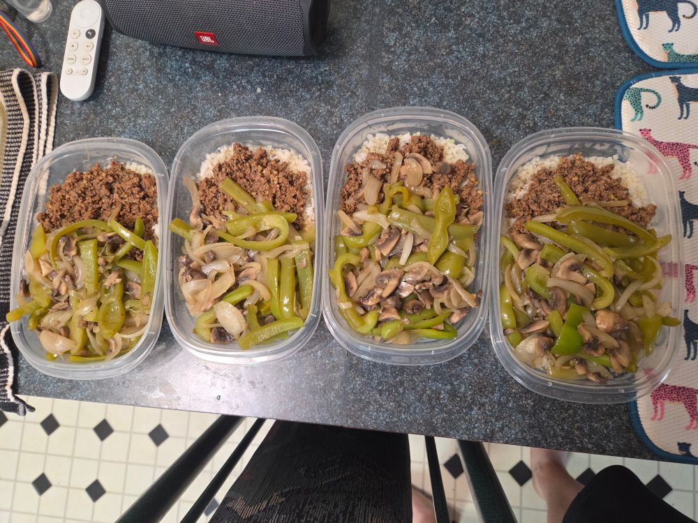 For rectangular meal prep containers. Each contains a mixture of rice, ground turkey, bell peppers, onions and mushrooms.