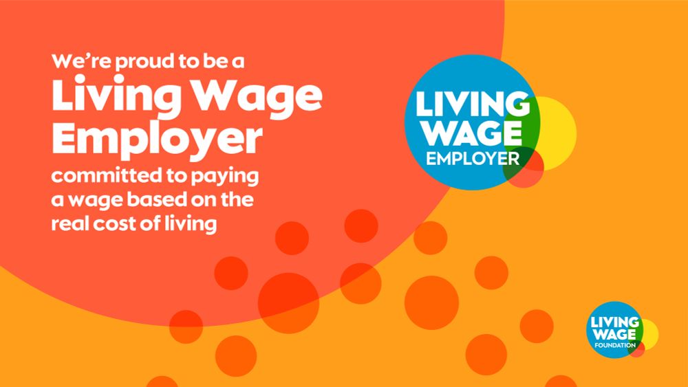 Graphic with the text: We're proud to be a Living Wage Employer committed to paying a wage based on the real cost of living