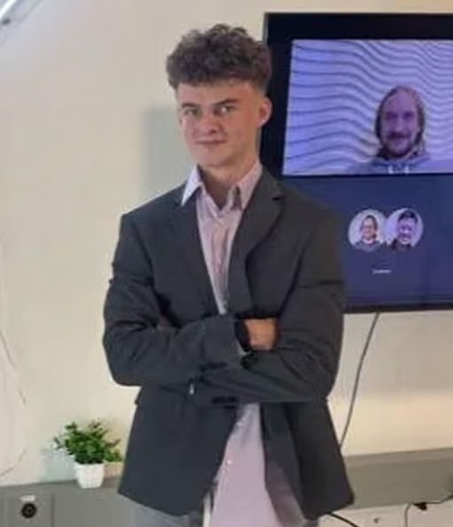 A picture of Ed "Big Balls" Coristine. 

He has awful hair and an untucked button up shirt.