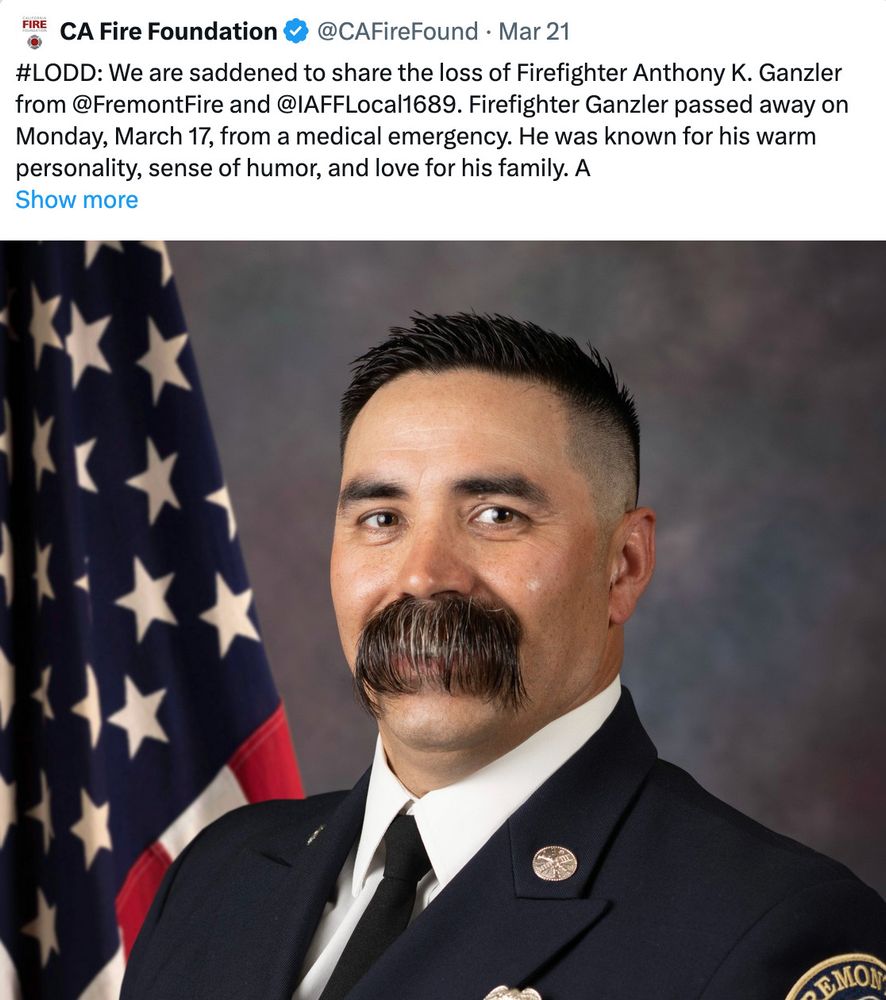 Man with obscenely long mustache that covers both his lips, curtaining over them like bangs