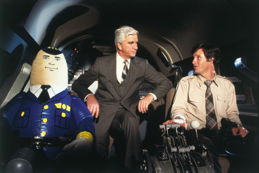 Airplane! movie scene with Leslie Nielson and an inflatable co-pilot.