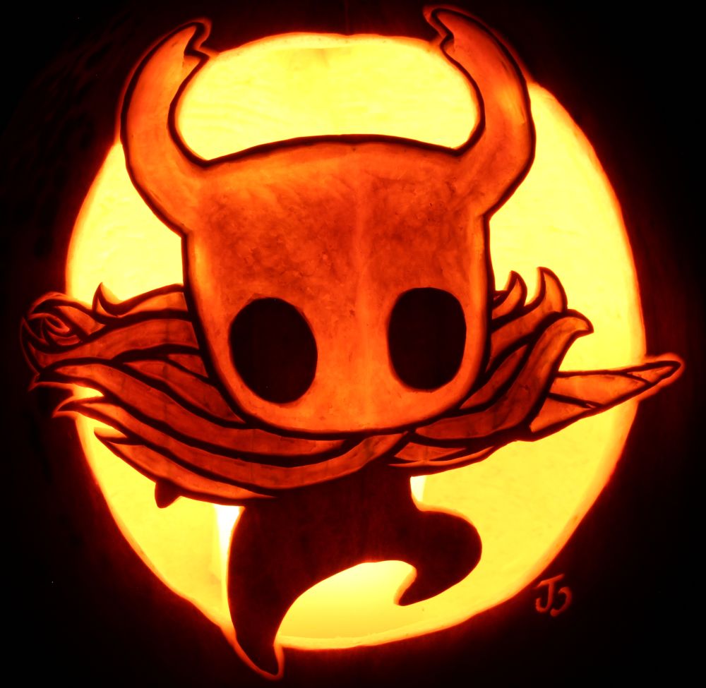 Pumpkin carving of the Knight from Hollow Knight, using various layers of shading on their head, cape, and nail, with the background cut out in a circle. 