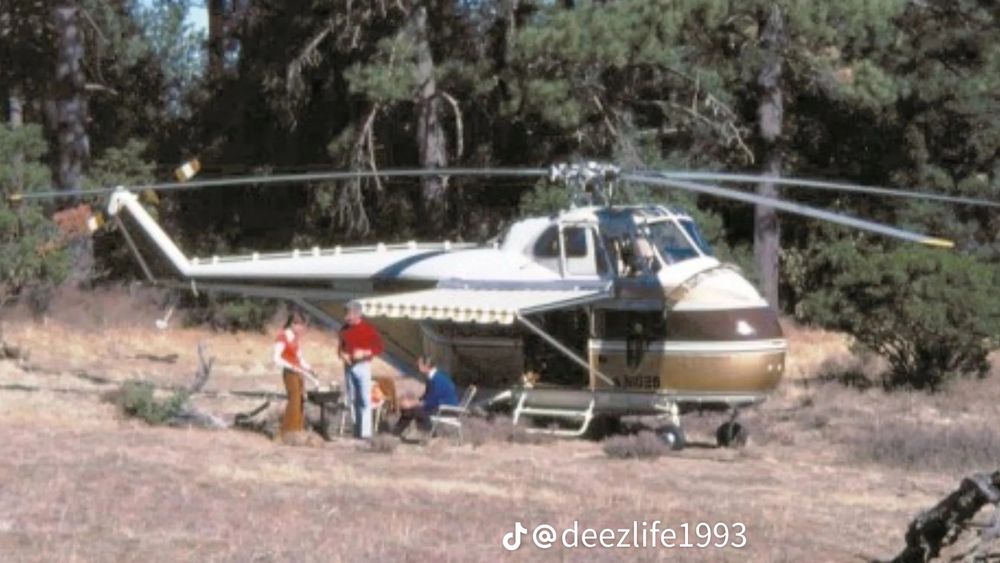 A photo of the Winnebago Heli-home caravan/RV, a motorhome inside of a helicopter in use by a family. It looks a little small to be comfortable. 