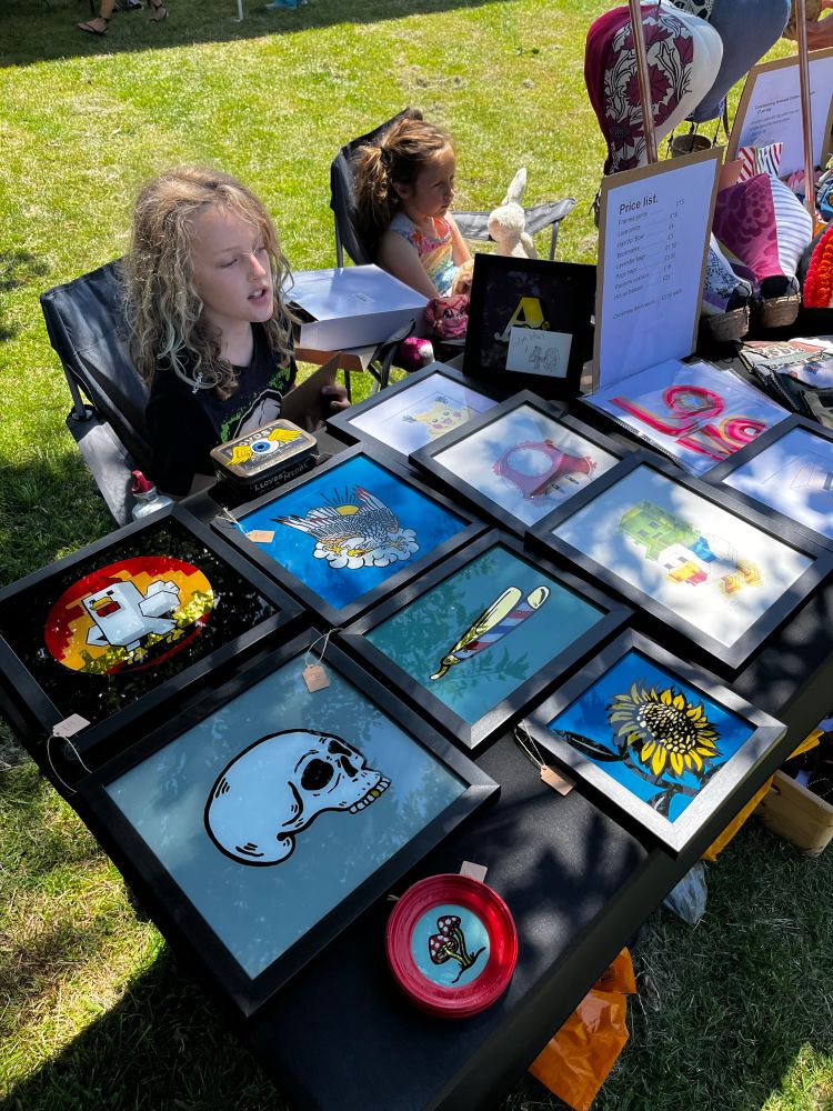 My boy sat behind a craft stall with some pictures and hand made things for sale