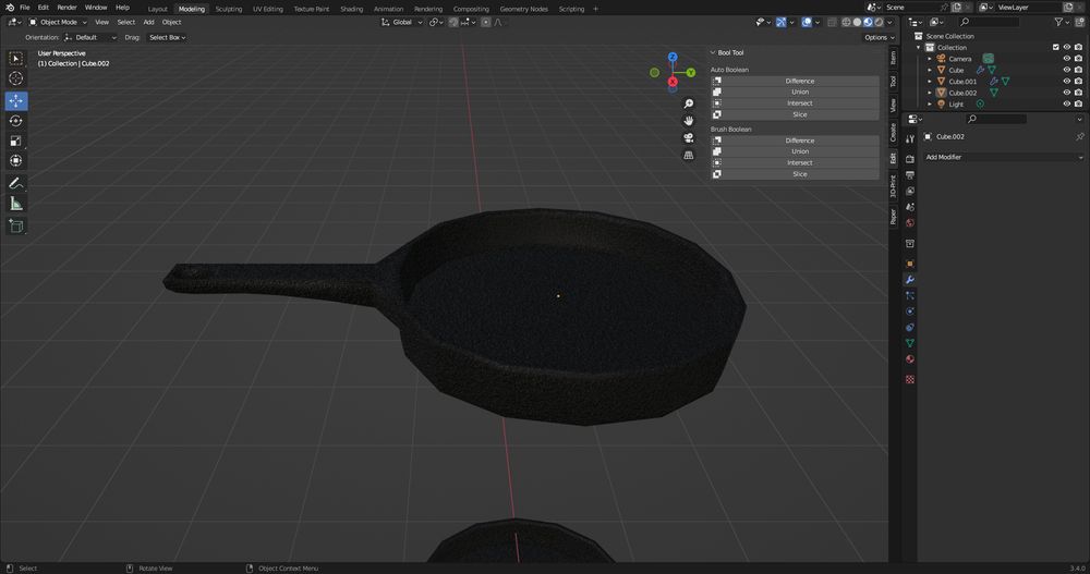 A blender window with a 3D model of a frying pan