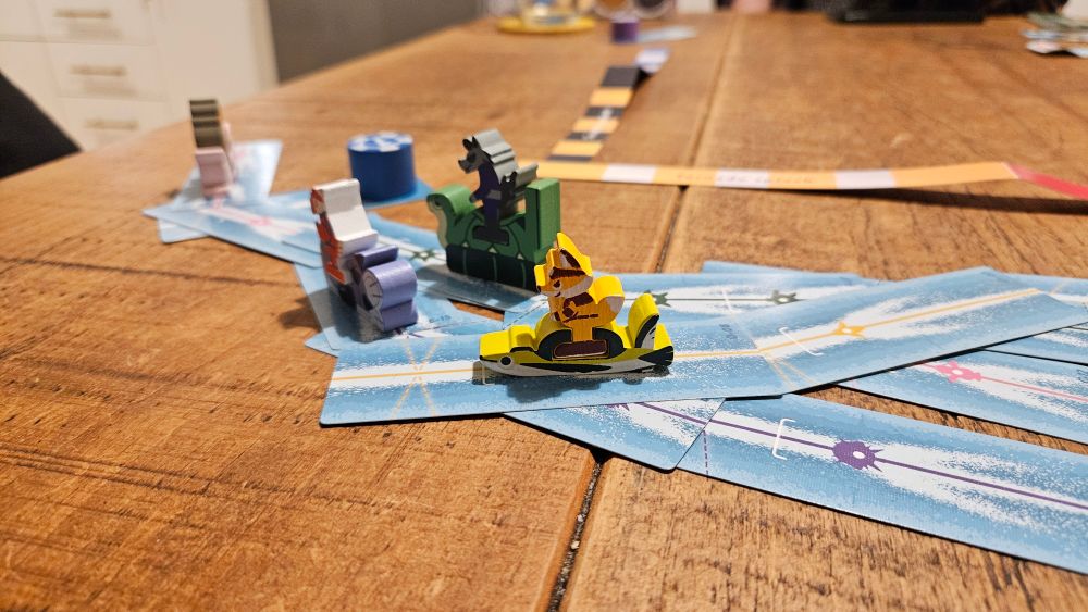 The first corner, a collection of jetski meeples, hare around , leaving wake cards behind them