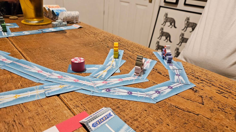 Thr final bend, those who've gone wide are setup for the finish. Others careen off the table