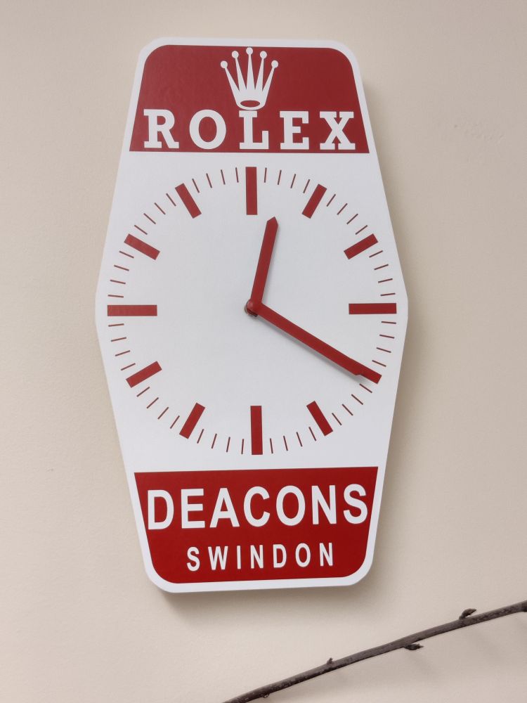 A replica Rolex clock. It's twenty past twelve.