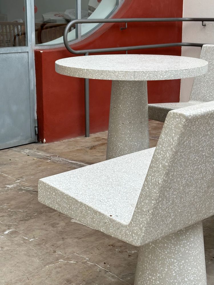 A photograph of a custom bench and table by Jasper Morrison in Majorca