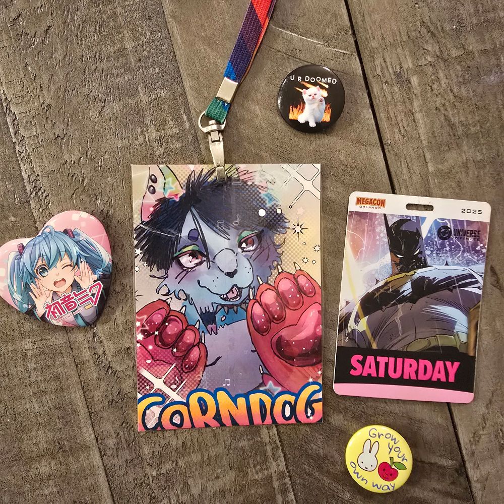 The front side of the con badge! This shows my fursona corn dog this is a proto type, so yours will look alot better, but this gi es if the basic idea!