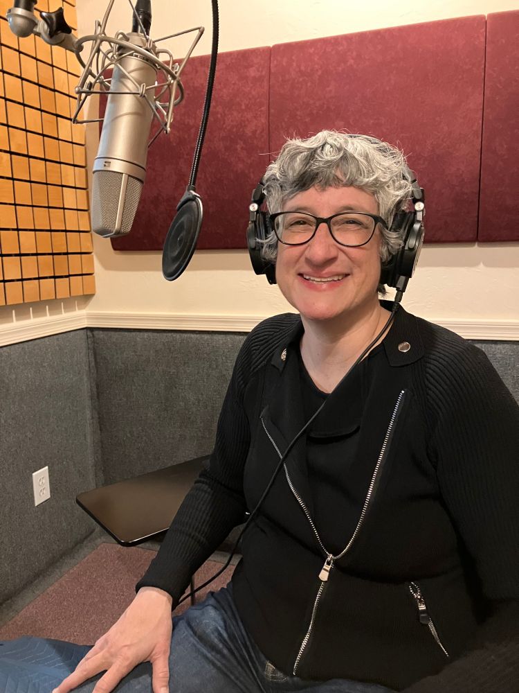 Author in a sound booth 