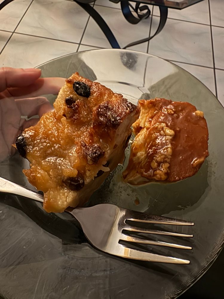 A large chunk of bread pudding and a big spoonful of flan