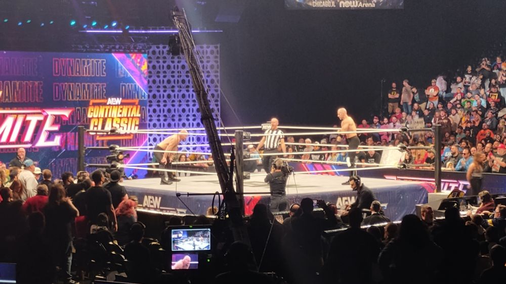 View of Jon Moxley vs. Claudio Castagnoli at Fishers Event Center, December 3 2025. A camera crane partially obstructs our view.