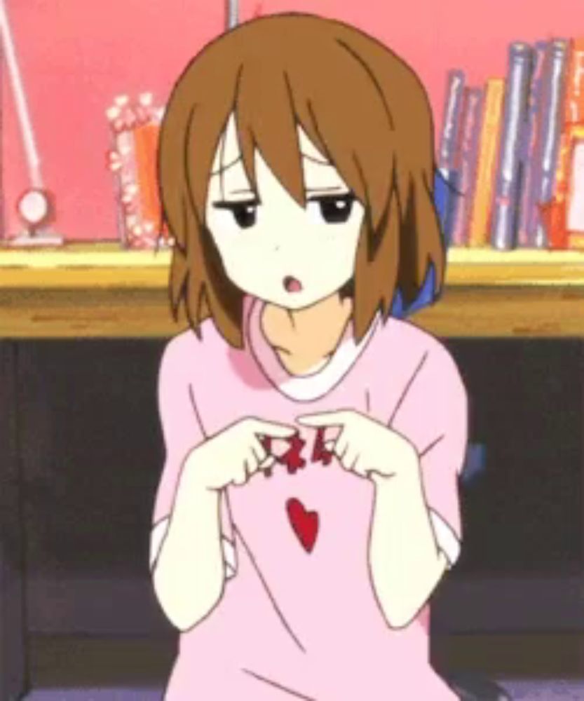 a girl in a pink shirt with a red heart on it