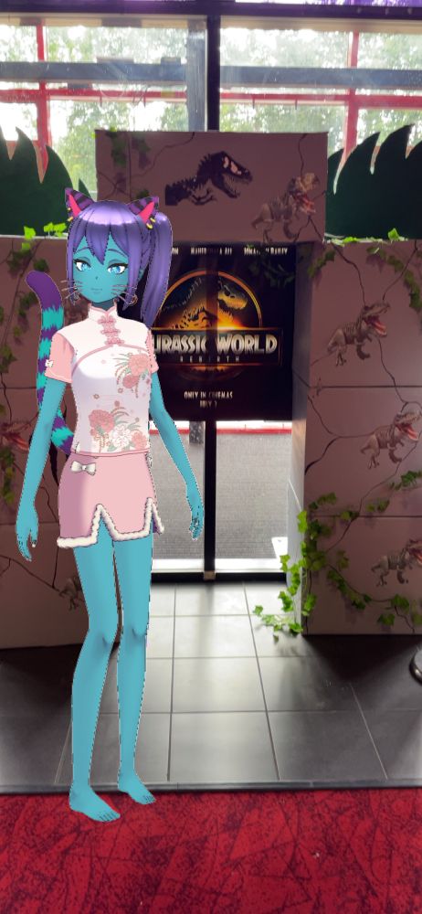 Photo of online avatar standing next to a Jurassic Workd Rebirth photo display at Cineworld 
