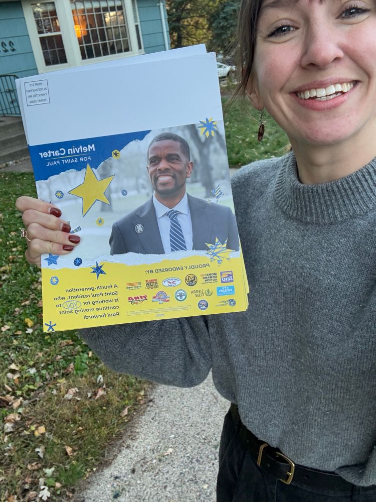 Selfie of Molly holding campaign lit for Melvin Carter