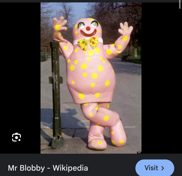 Mr Blobby leaning on a lamppost 