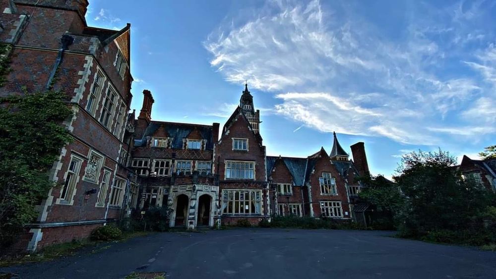 The same house from a courtyard against blue sky 